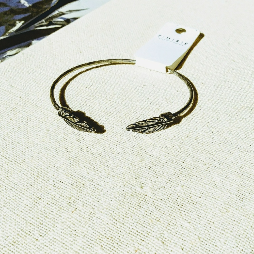 Double feather metallic silver cuff bracelet
